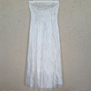 Elegant Strapless White Evening Gown with Gold Beading